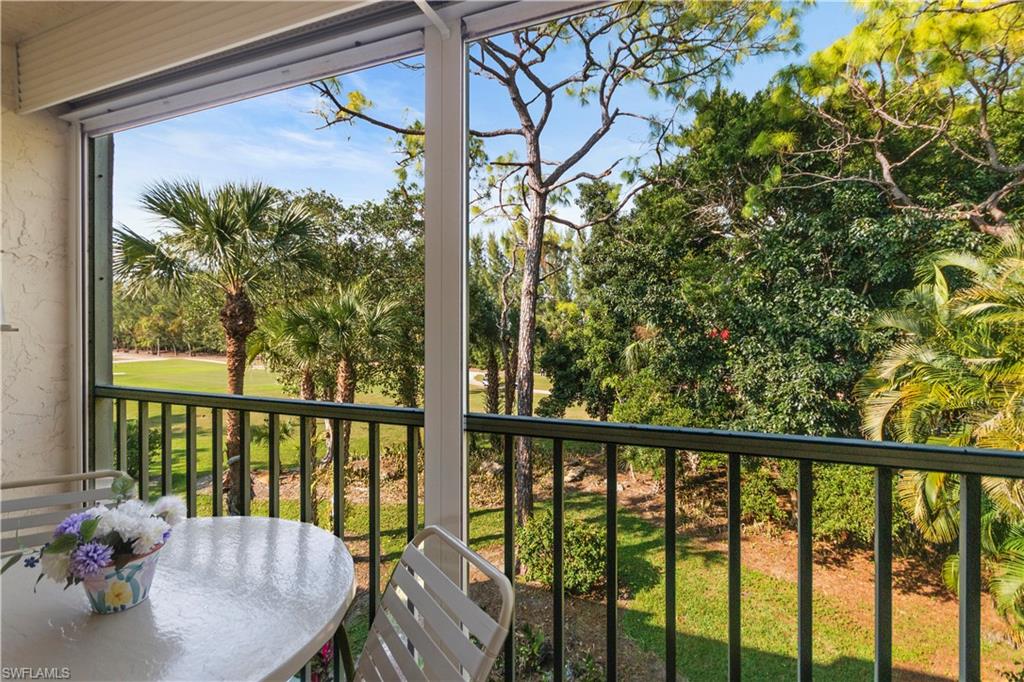 499 Forest Lakes Boulevard, Unit 2304 Naples, FL 34105 - Photo 3 of 21 a view of a porch with furniture