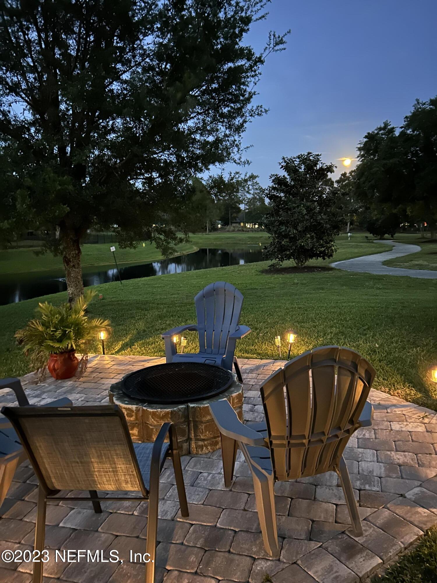 120 East Franchetta Lane St. Augustine, FL 32092 - Photo 5 of 25 a view of a swimming pool and lounge chairs in back yard