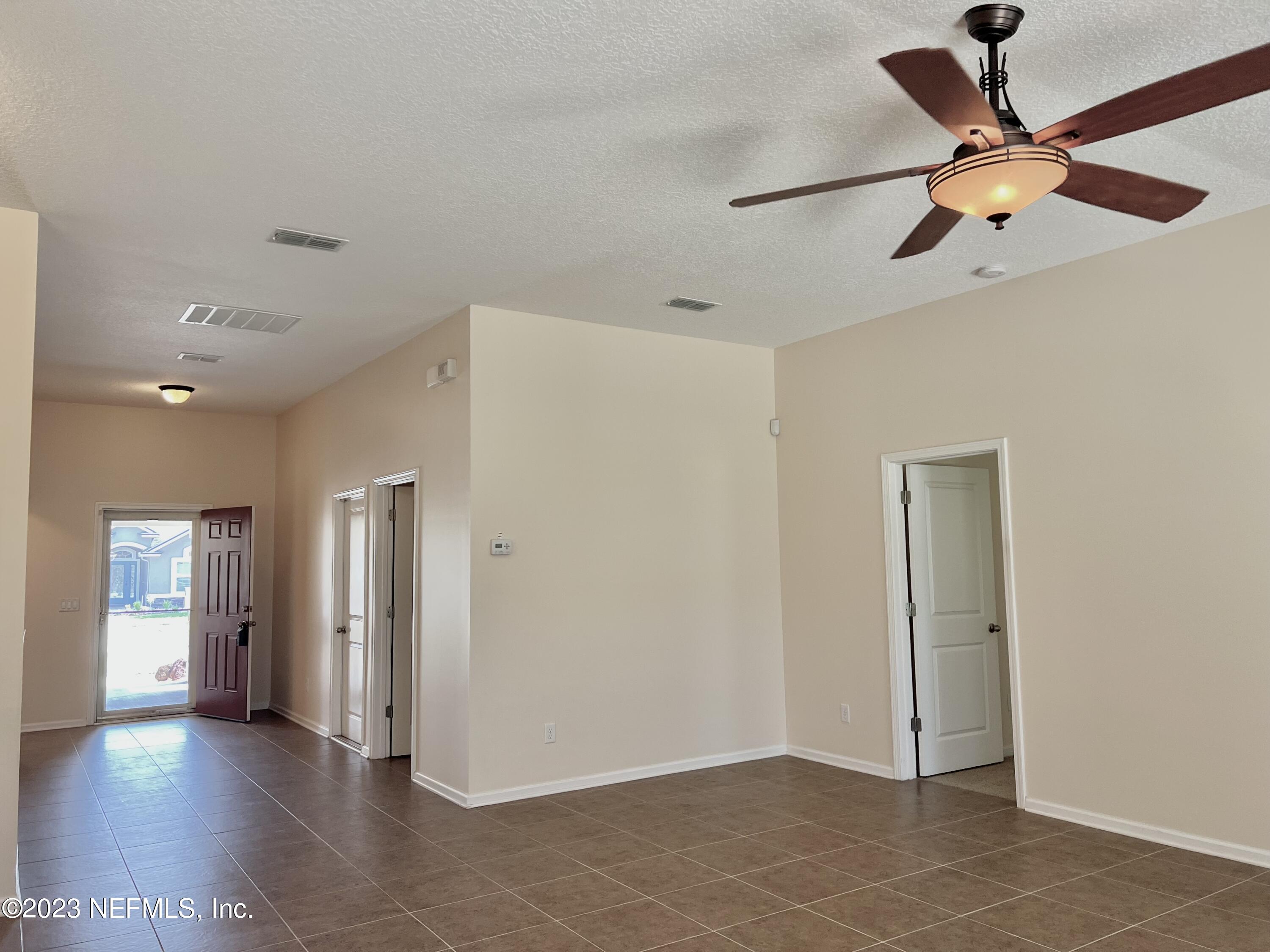 120 East Franchetta Lane St. Augustine, FL 32092 - Photo 6 of 25 a view of an empty room and window