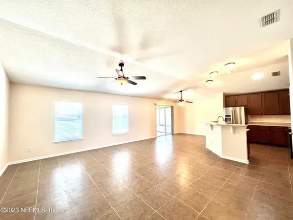 a view of a kitchen with furniture and a kitchen