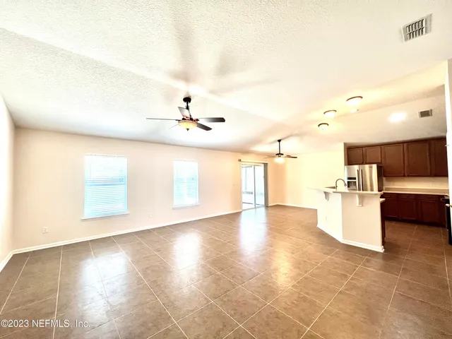 a view of a kitchen with furniture and a kitchen