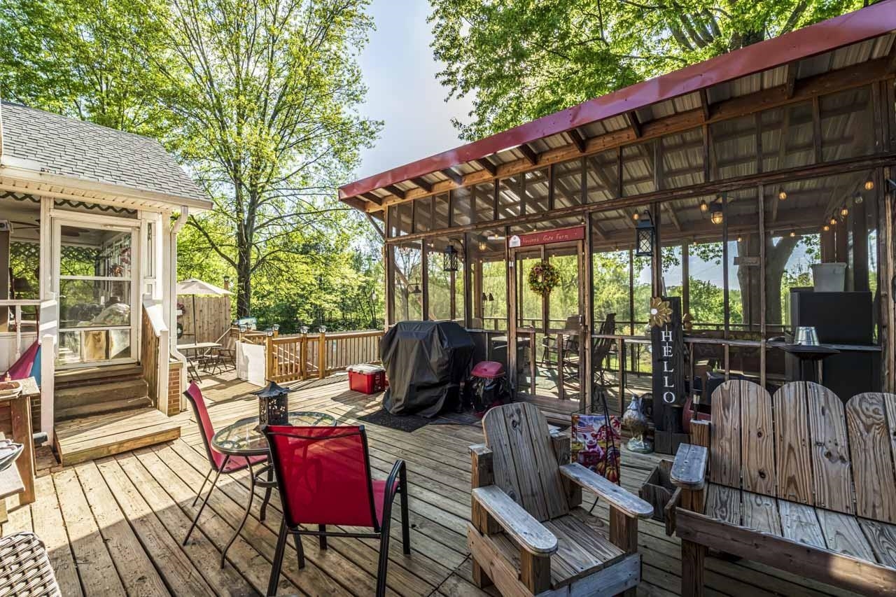 937 Kelleys Chapel Road Burlison, TN 38015 - Photo 25 of 40 Wooden deck featuring a sunroom and grilling area
