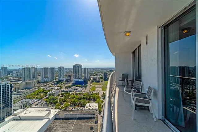 a view of a balcony with chairs