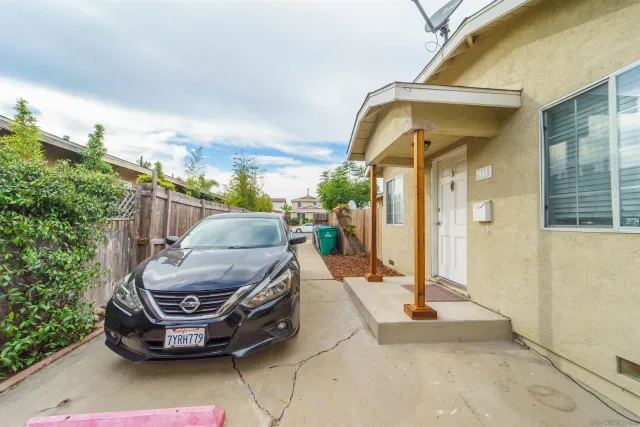 a car parked in front of a house