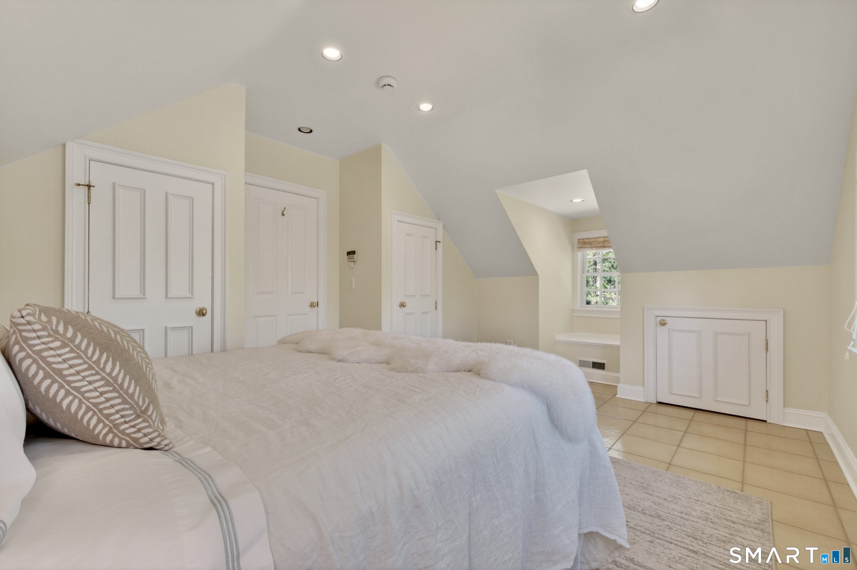 41 Peaceable Street Ridgefield, CT 06877 - Photo 32 of 40 a bedroom with a bed and a painting