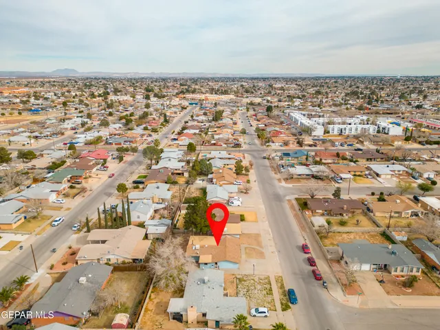 an aerial view of residential houses with outdoor space