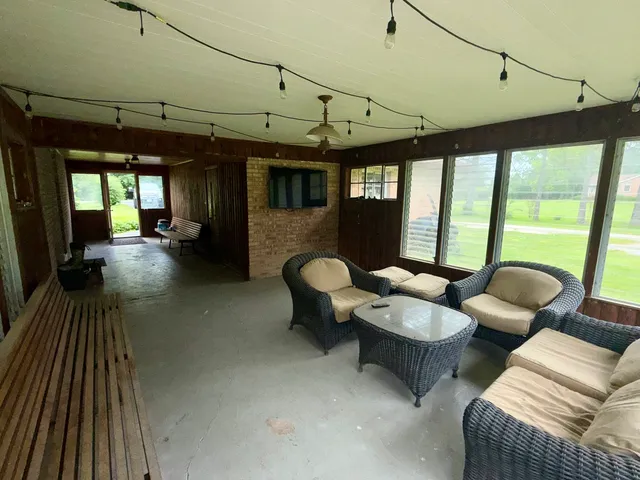 a view of a livingroom with furniture window and outside view