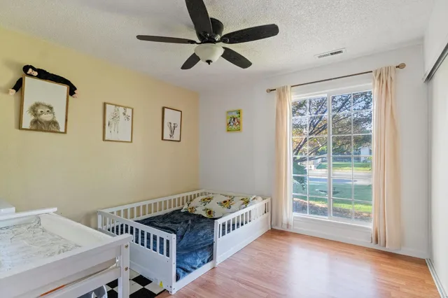 a bedroom with furniture and a window