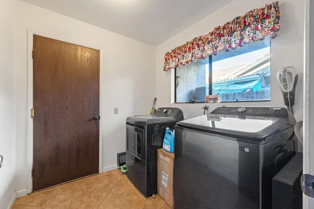 a kitchen with a sink and a refrigerator