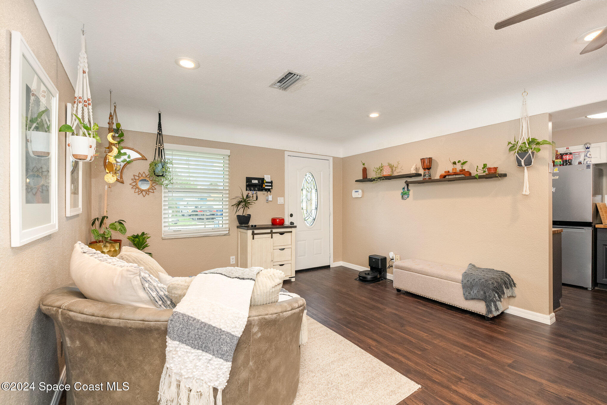 800 1st Street Merritt Island, FL 32953 - Photo 18 of 28 a living room with furniture and a wooden floor