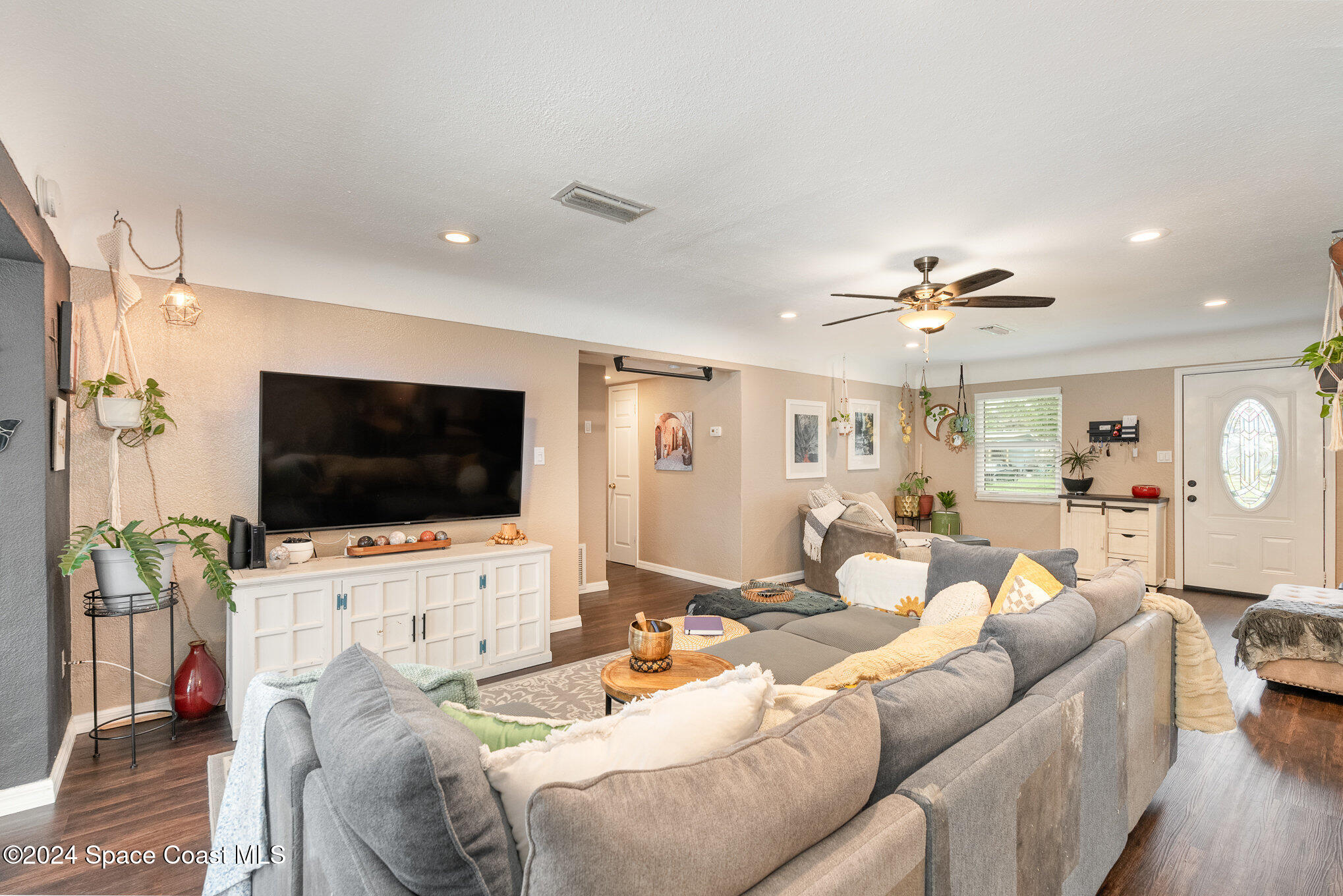 800 1st Street Merritt Island, FL 32953 - Photo 19 of 28 a living room with furniture and a flat screen tv
