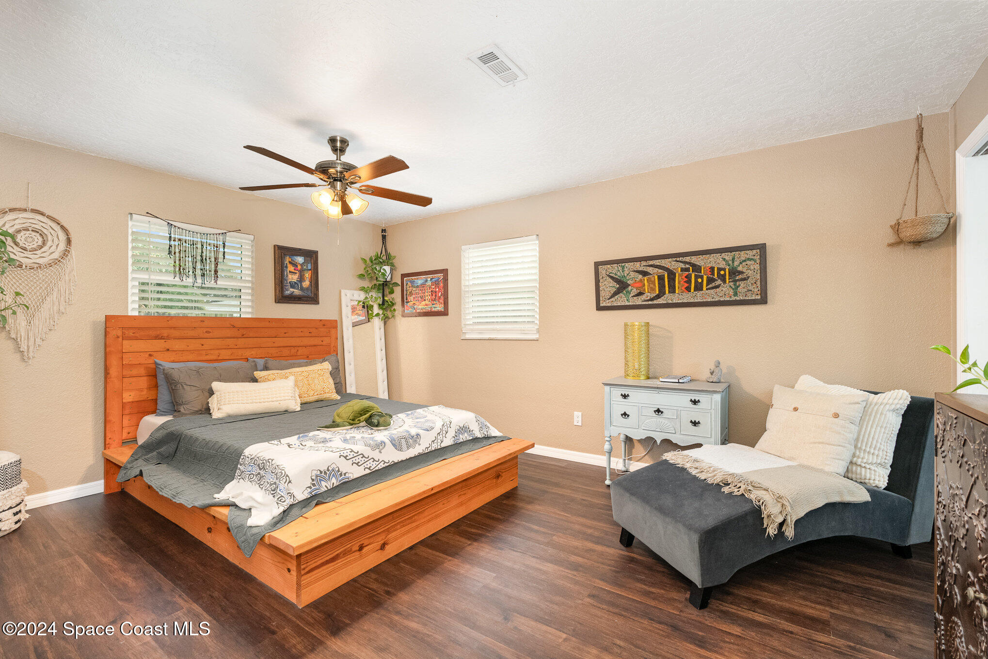 800 1st Street Merritt Island, FL 32953 - Photo 6 of 28 a bedroom with a bed and wooden floor