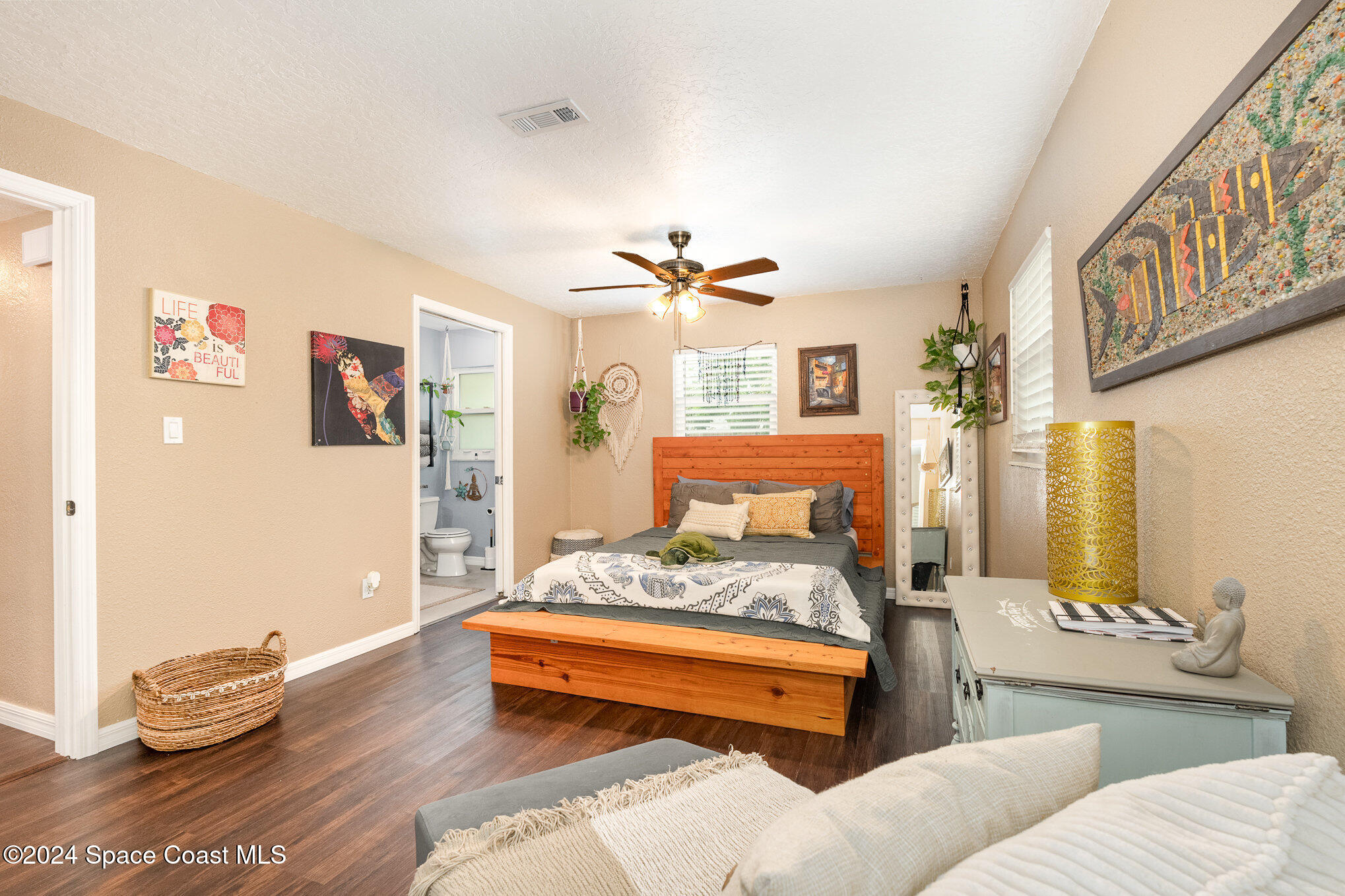 800 1st Street Merritt Island, FL 32953 - Photo 7 of 28 a bedroom with furniture and a chandelier