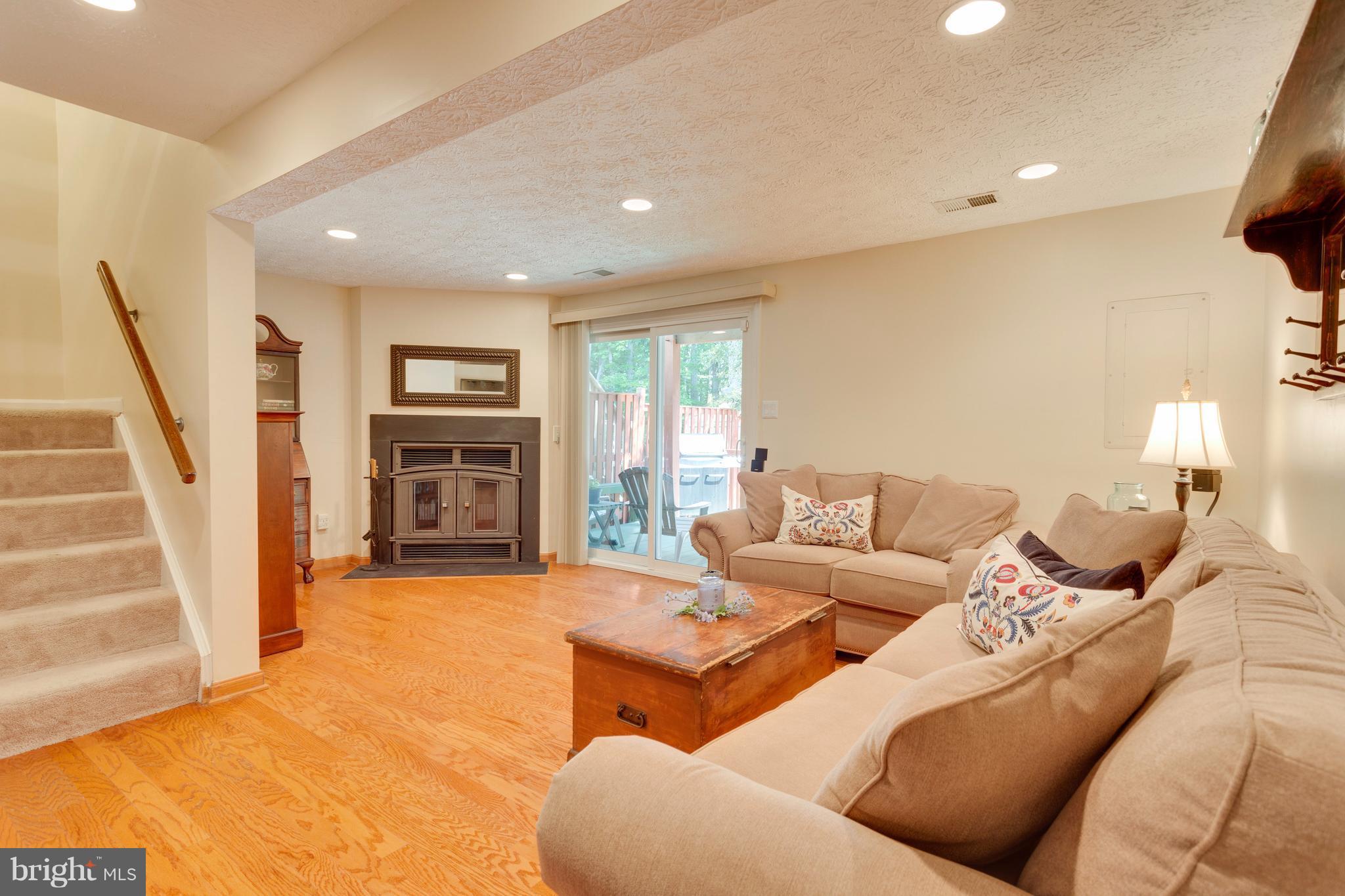 6571 Forest Dew Court Springfield, VA 22152 - Photo 13 of 20 a living room with furniture and a fireplace