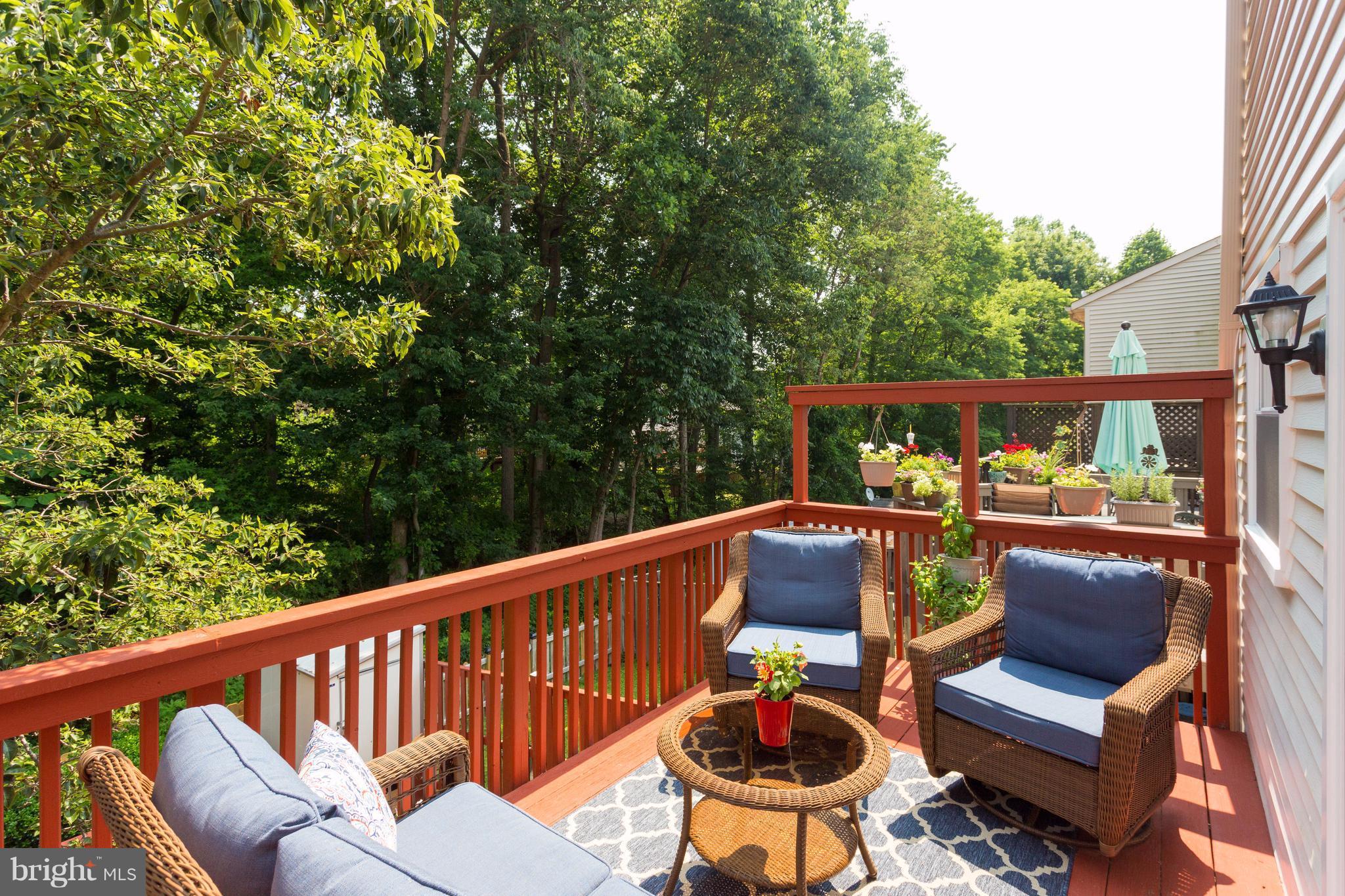 6571 Forest Dew Court Springfield, VA 22152 - Photo 15 of 20 a balcony with wooden floor and outdoor seating