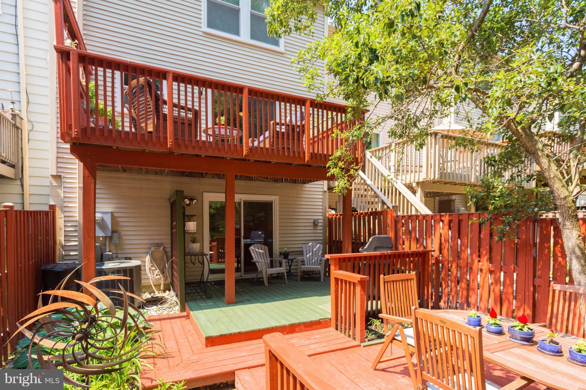 6571 Forest Dew Court Springfield, VA 22152 - Photo 19 of 20 a view of a dinning tables and chairs in patio