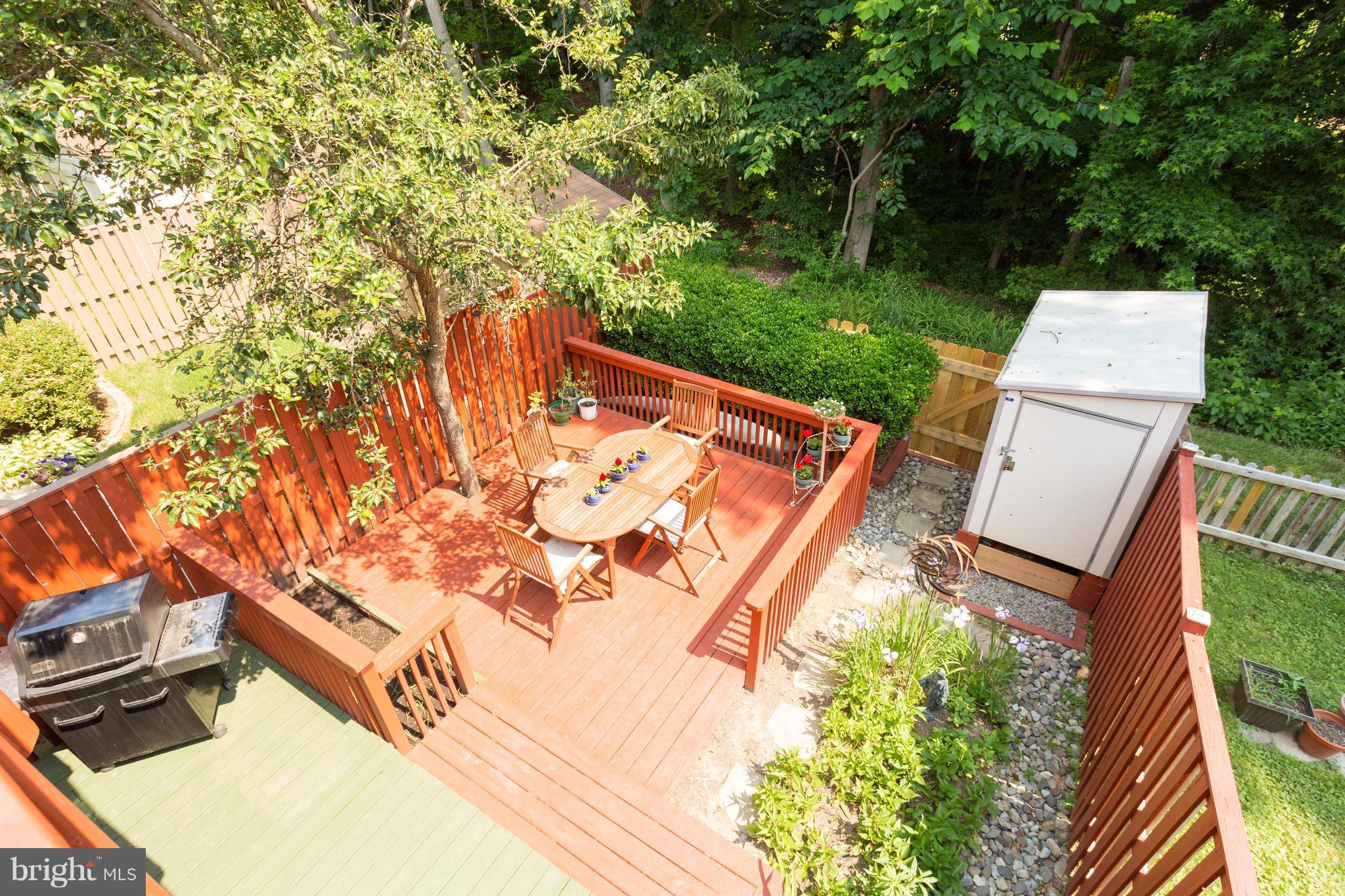 6571 Forest Dew Court Springfield, VA 22152 - Photo 20 of 20 a backyard of a house with lots of green space