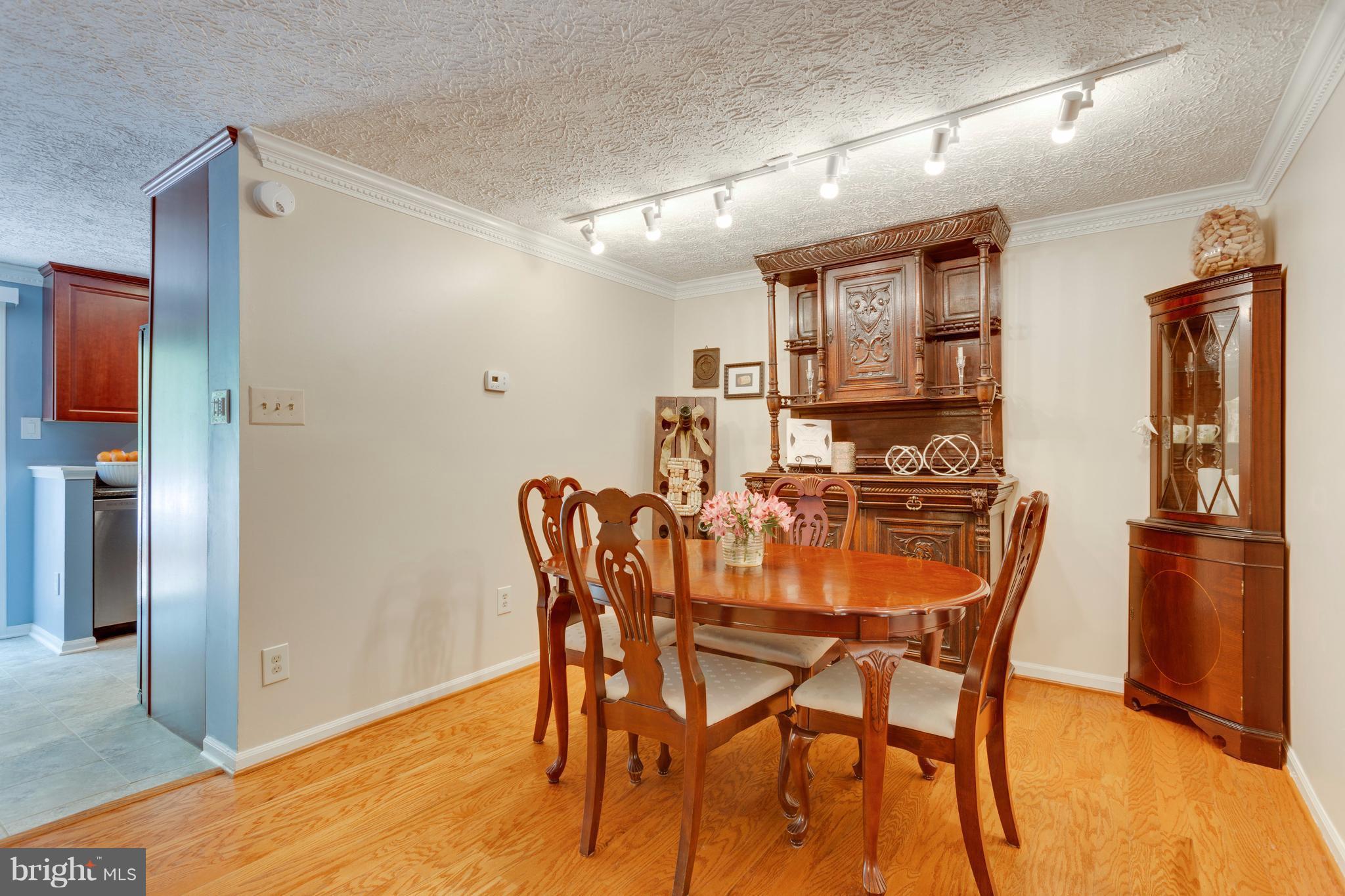 6571 Forest Dew Court Springfield, VA 22152 - Photo 4 of 20 a view of a dining room with furniture