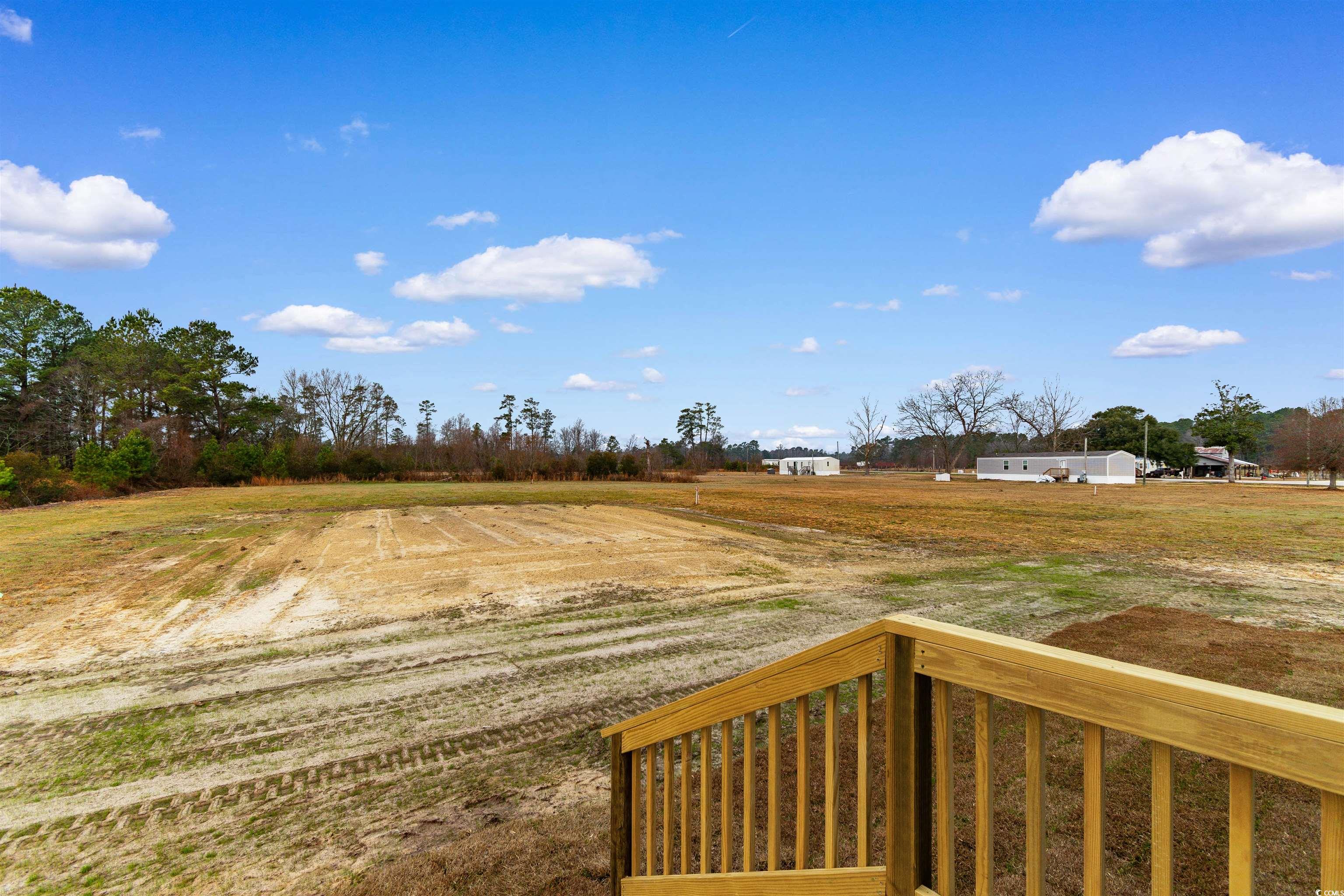 6613 Strickland Road Green Sea, SC 29545 - Photo 26 of 38 View of yard featuring a balcony