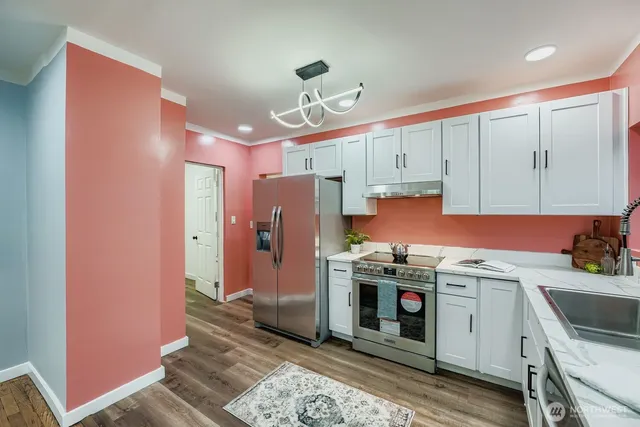 a kitchen with a sink stove and window