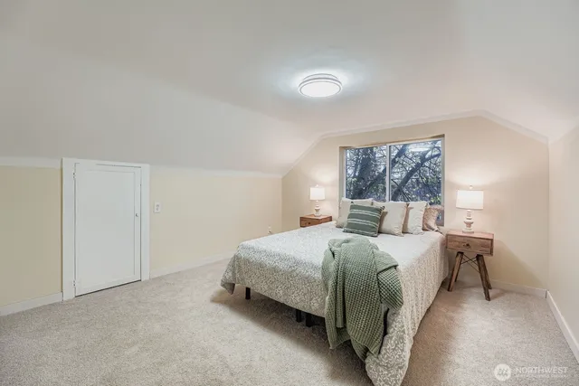 a bedroom with a bed and window