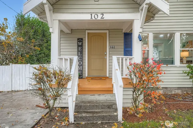 a view of an entryway with wooden floor