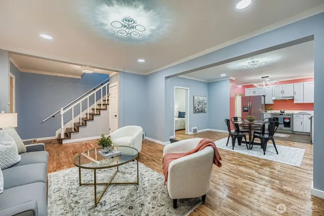 a view of a dining room with furniture and chandelier