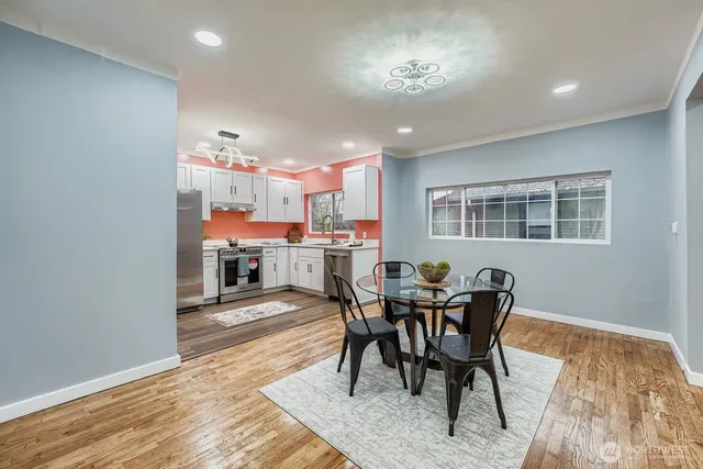 a dining room with a table or chairs and a dining table with wooden floor