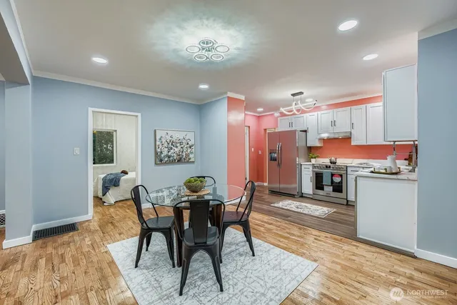 a view of a dining room with furniture window and wooden floor