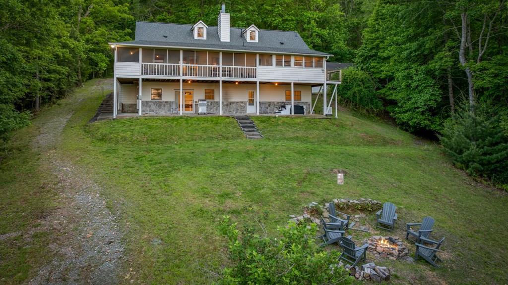 760 River Bend Lane Blue Ridge, GA 30513 - Photo 2 of 101 a front view of a house with a yard