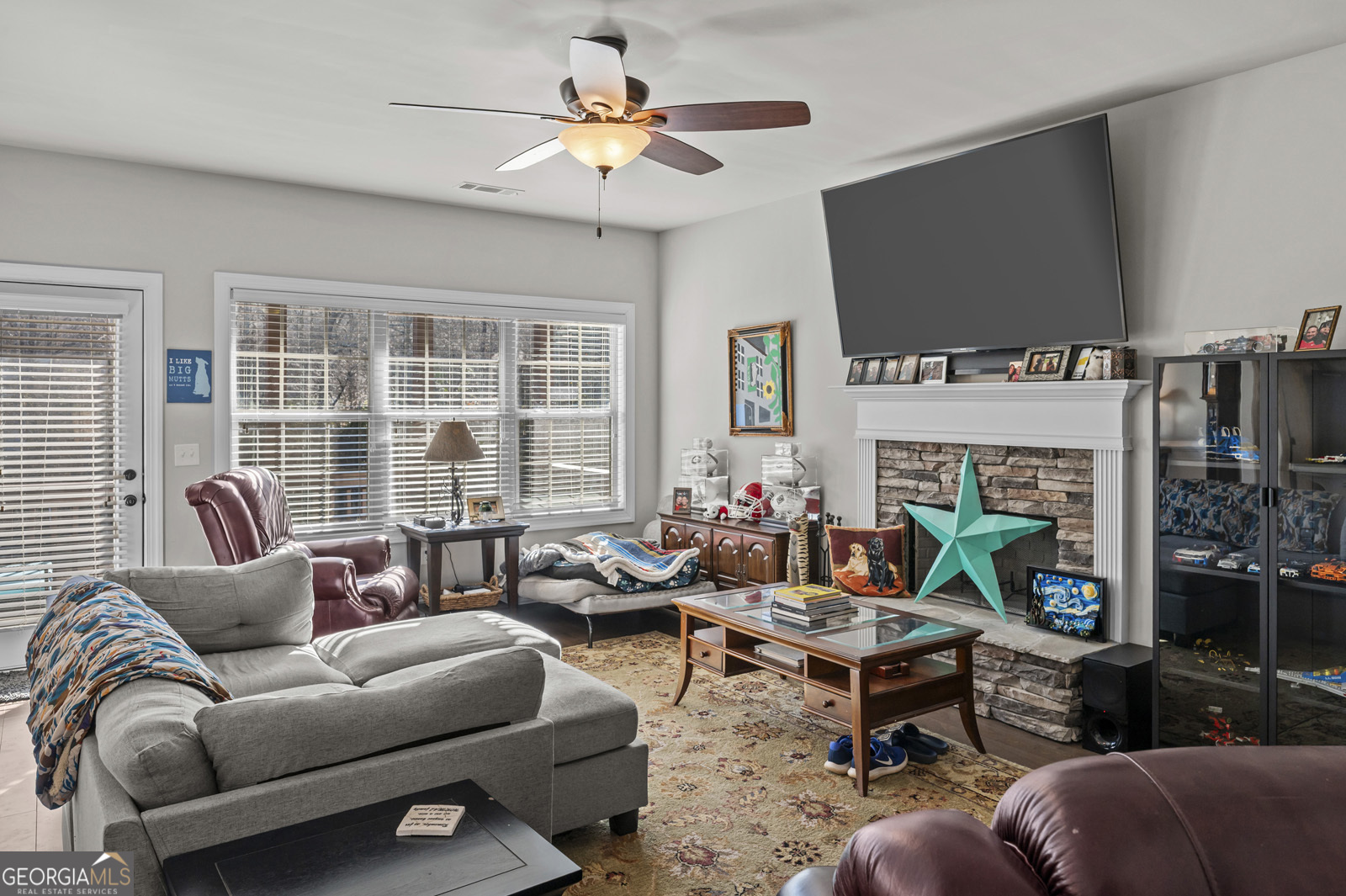 381 Township Lane Athens, GA 30606 - Photo 21 of 68 a living room with furniture a flat screen tv and a fireplace