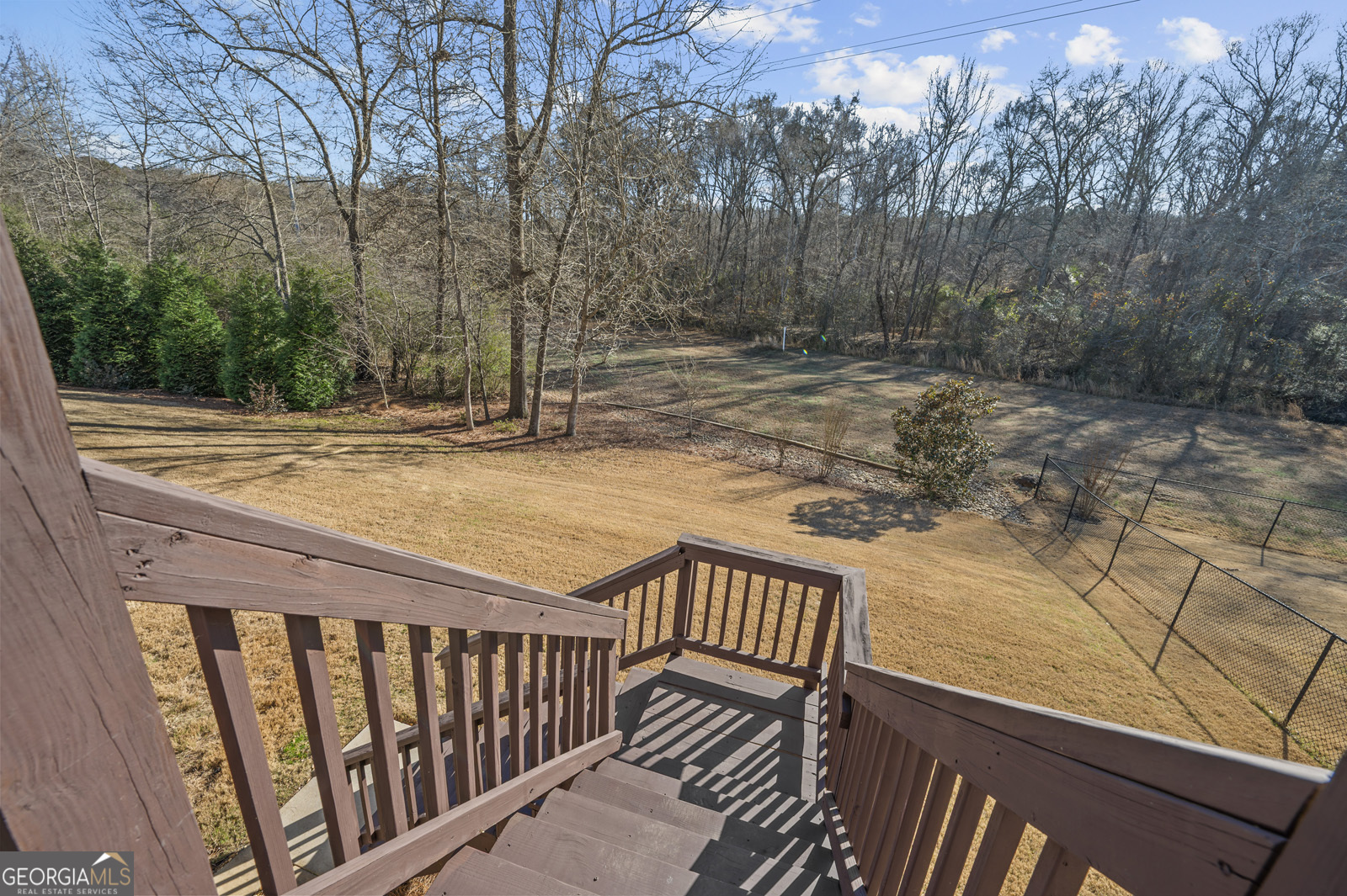 381 Township Lane Athens, GA 30606 - Photo 33 of 68 a view of a balcony with wooden fence