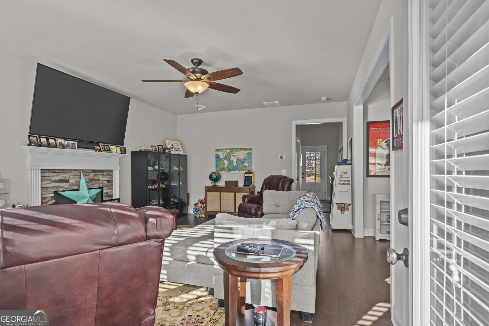 381 Township Lane Athens, GA 30606 - Photo 34 of 68 a living room with furniture a flat screen tv and a fireplace