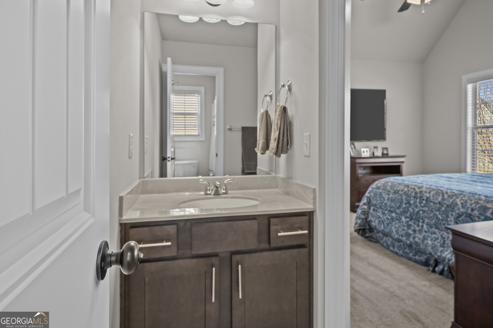 381 Township Lane Athens, GA 30606 - Photo 41 of 68 a en suite bathroom with a granite countertop sink and a mirror