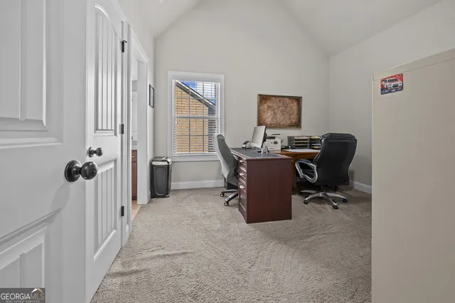 a view of walk in closet with clothes