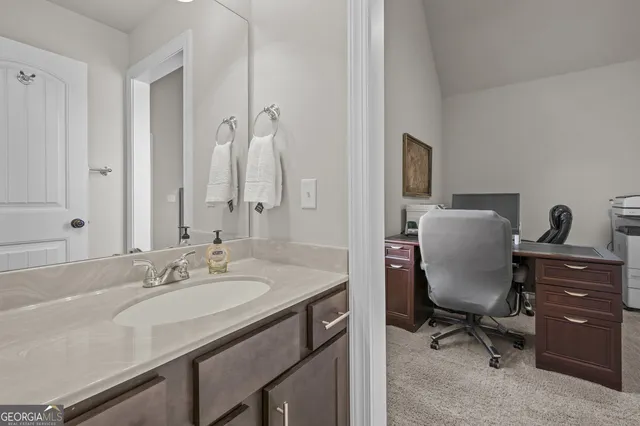 a bathroom with a bathtub and a sink