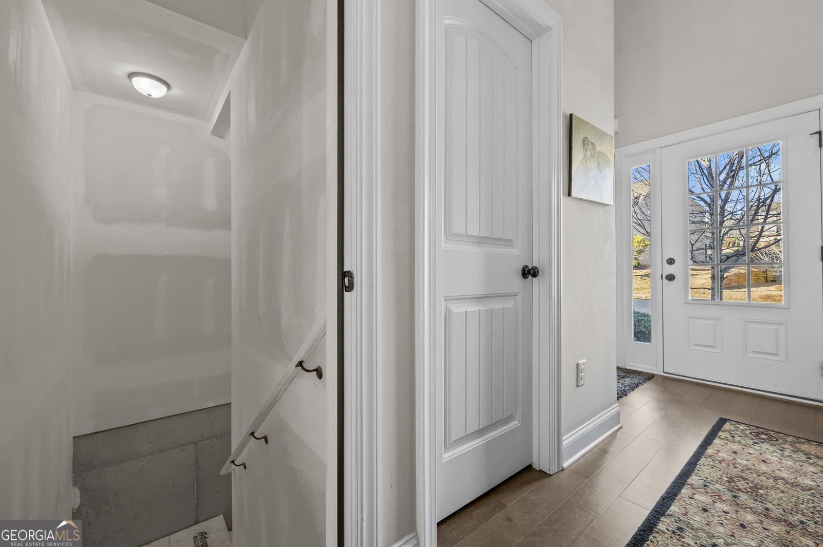 381 Township Lane Athens, GA 30606 - Photo 62 of 68 a view of a hallway with wooden floor and a bathroom