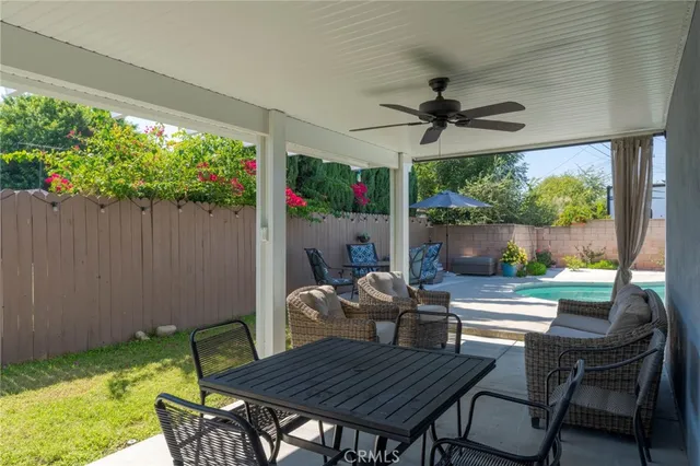 a outdoor dining space with furniture and garden view
