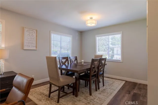 a view of a dining room with furniture and window