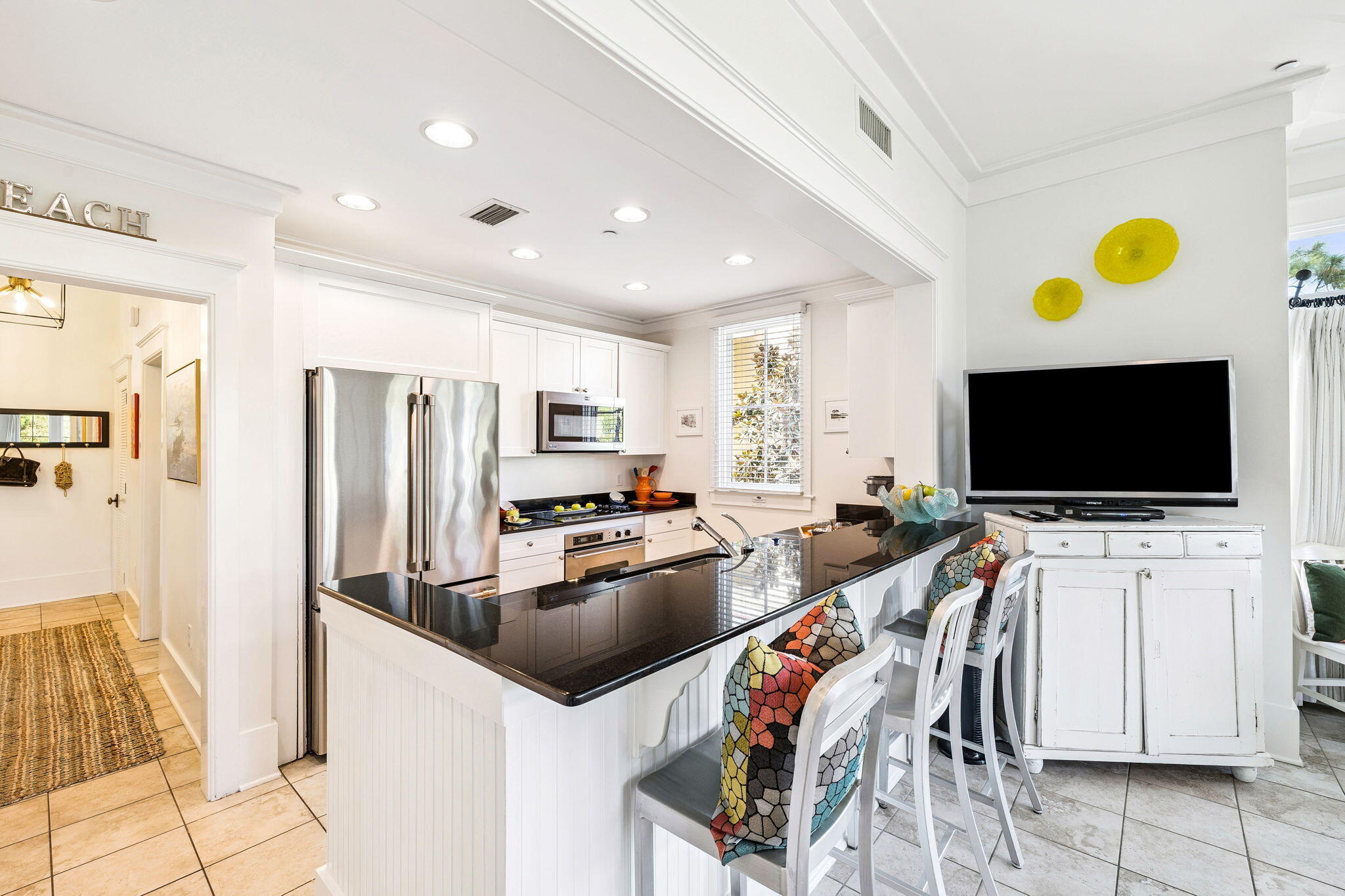 1640 East County Highway 30A, Unit 302 Santa Rosa Beach, FL 32459 - Photo 13 of 64 a view of a livingroom with furniture and a flat screen tv