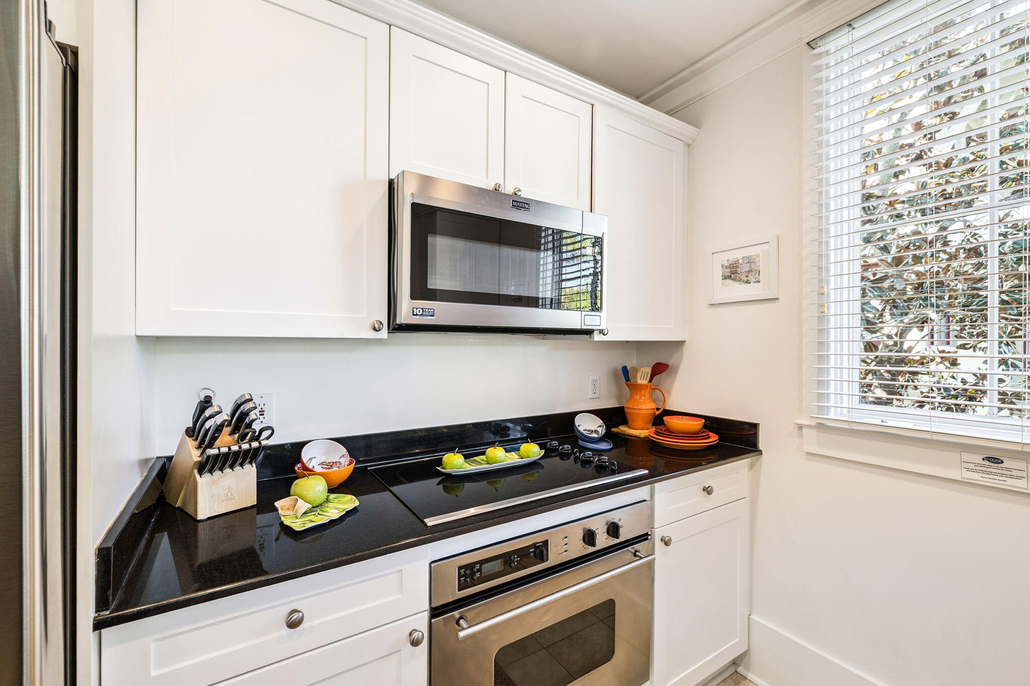1640 East County Highway 30A, Unit 302 Santa Rosa Beach, FL 32459 - Photo 16 of 64 a kitchen with a stove and a microwave