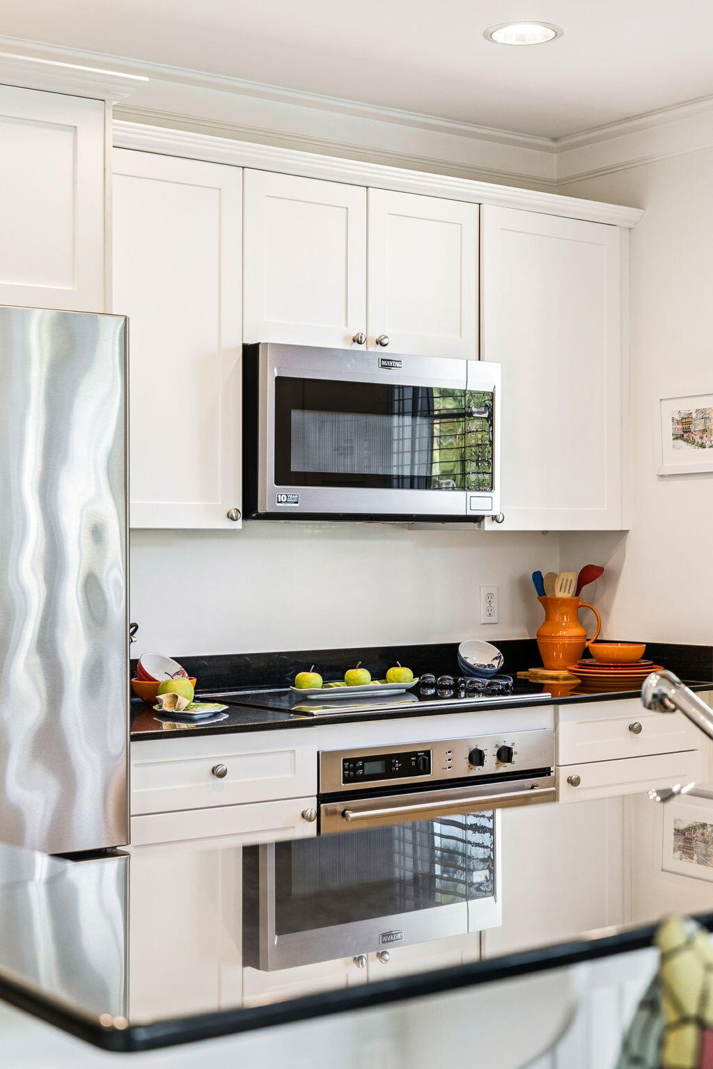 1640 East County Highway 30A, Unit 302 Santa Rosa Beach, FL 32459 - Photo 19 of 64 a kitchen with stainless steel appliances a stove a microwave and cabinets