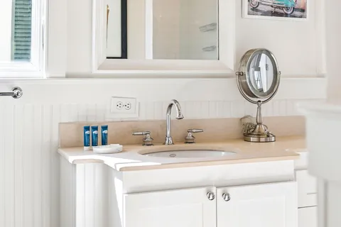a backyard of a house with table and chairs