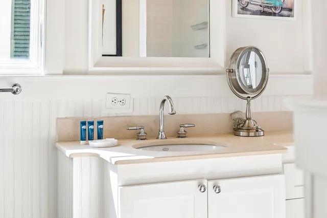 a backyard of a house with table and chairs
