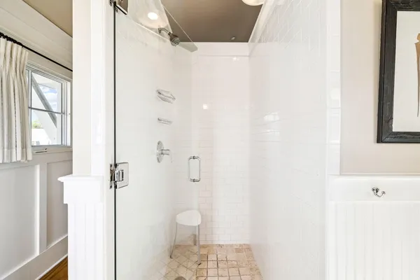 a view of a bathroom with a sink and mirror