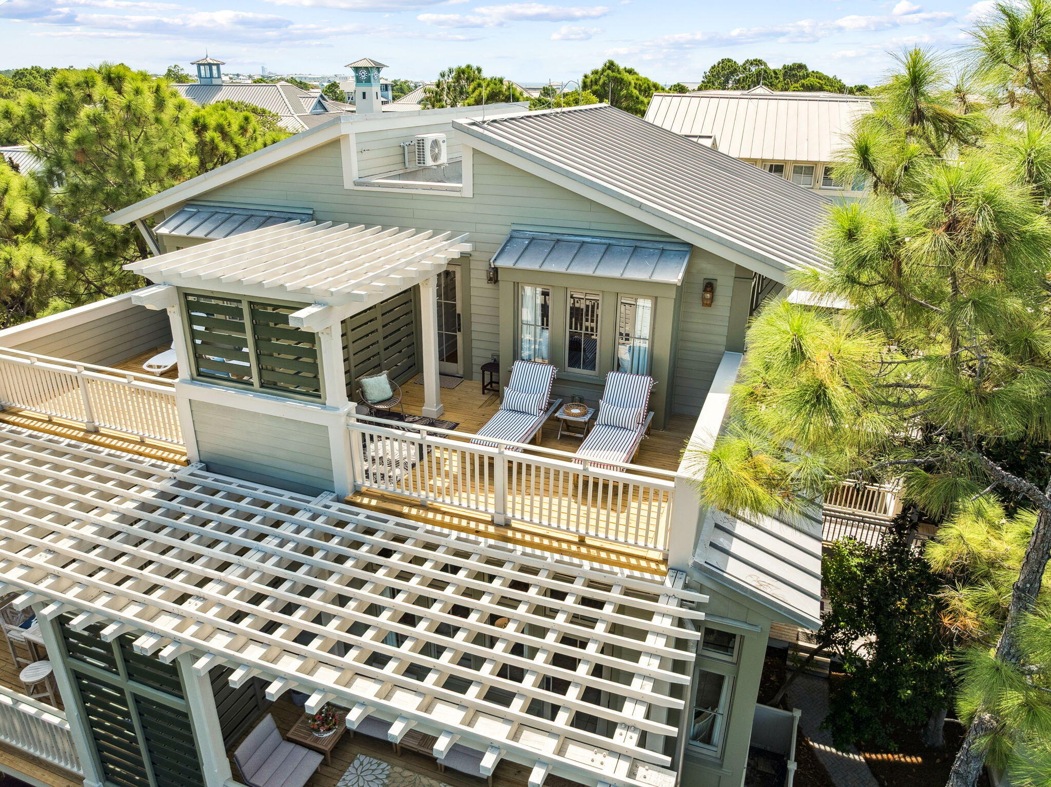 1640 East County Highway 30A, Unit 302 Santa Rosa Beach, FL 32459 - Photo 40 of 64 a backyard of a house with table and chairs