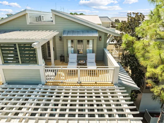 an aerial view of a house with a garden and plants