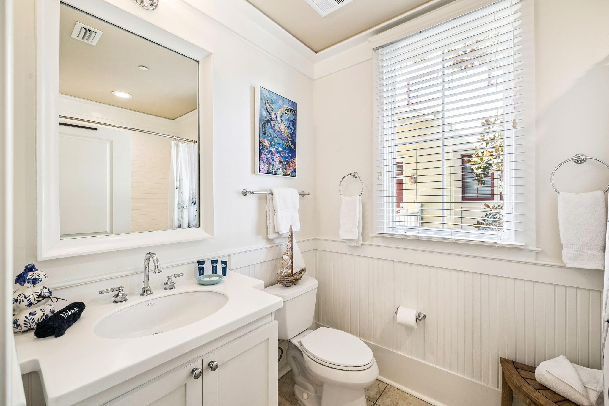 1640 East County Highway 30A, Unit 302 Santa Rosa Beach, FL 32459 - Photo 58 of 64 a bathroom with a sink toilet and a mirror
