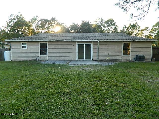 1041 Commerce Road Southeast Palm Bay, FL 32909 - Photo 3 of 7 Rear view of property.jpg