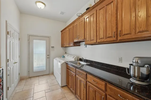 a kitchen with a sink and cabinets